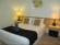 The master bedroom in Gannet Deluxe Villa at Raffertys Resort